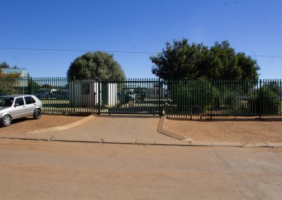 Construction of sidewalk and drop-off zone next to boundary of school